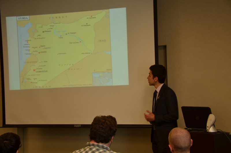Mahmoud Hallak during his presentation on the unrest in Syria.